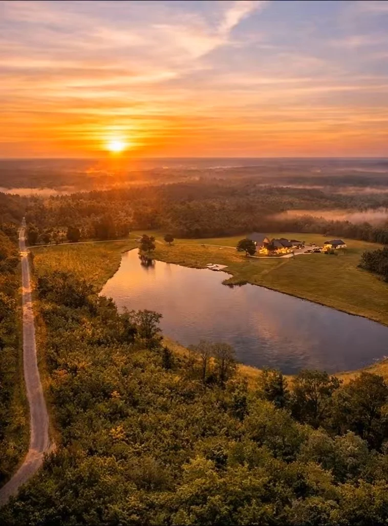 Aerial sunset view of Magnolia Fields 58-acre luxury estate